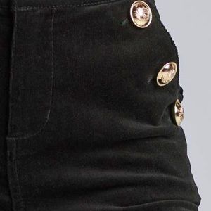 Brand new without tags. Black corduroy, flare pants with gold side buttons.